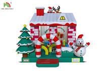 赤く/白い色のビジネスのためのクリスマス ツリーが付いている膨脹可能な弾力がある城の家